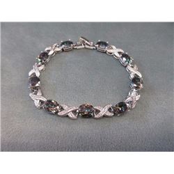 **** FEATURE ITEMS**** BRACELET - 34.5 CTW (9) OVAL FACETED MYSTIC TOPAZ IN STERLING SILVER SETTING 