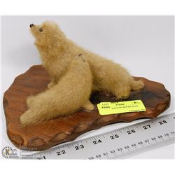 PAIR OF SEALS ON WOODS BASE