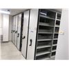 Image 1 : Rolling-Shelf Bookcase System w/7 Back to Back Shelving Sections on a Track (each section slides bac