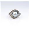 Image 1 : Exquisite ring featuring a center black South  Sea Pearl averaging 10.00 MM in diameter of  nice col
