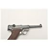 Image 5 : Luger semi-automatic pistol by DWM, 9mm  caliber, 4” barrel, blued finish, checkered  wood grips, S/