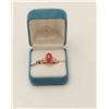Image 1 : One 18k rose gold ladies ring set with a  Burmese ruby cabochon weighing approx 5 ct   and 2 side di