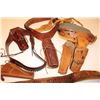 Image 1 : Two leather flap holsters for Luger  semi-automatic pistols, one black, one brown.        Est.:  $20