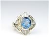 Image 1 : Dazzling ladies ballerina design ring  featuring an oval blue sapphire weighing 4.63  carats and sur