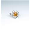 Image 1 : Stunning ladies ring featuring a Mandarin  Orange sapphire weighing approx. 3.00 carats  and micro s