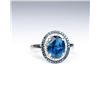 Image 1 : Stylish ring set with a London blue Topaz and  surrounded by 60 round white and blue  diamonds with 