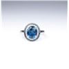 Image 2 : Stylish ring set with a London blue Topaz and  surrounded by 60 round white and blue  diamonds with 