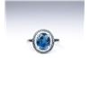 Image 3 : Stylish ring set with a London blue Topaz and  surrounded by 60 round white and blue  diamonds with 