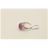 Image 1 : One 18k white halo gold ladies ring set with  a Burmese ruby cabochon weighing approx 6 ct   EST.$1,