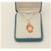 Image 1 : One beautiful salmon coral set in a 14k  yellow gold floral design pendant.  EST.$500-600