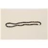 Image 1 : One fine quality strand of black pearls  23inches long and of 9mm in diameter (14k  white gold clasp