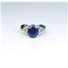 Image 1 : Nice ladies ring featuring an oval Sapphire  weighing approx. 4.00 carats and 8 side  diamonds set i
