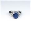 Image 4 : Nice ladies ring featuring an oval Sapphire  weighing approx. 4.00 carats and 8 side  diamonds set i
