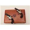 Image 1 : Pair of Colt New Model single shot  derringers, .22 short caliber, 2.5” barrels,  blued and gold was