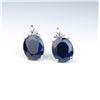 Image 1 : Elegant earrings featuring two matching oval  blue Sapphires weighing 8.50 carats and six  side acce