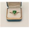 Image 1 : One exceptional trilliant cut Green garnet  ring set in 14k yellow gold with 2 baguette  diamonds. E
