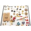 Image 2 : Lot of U.S. military medals and insignias in  large riker case.       Est.:  $50-100