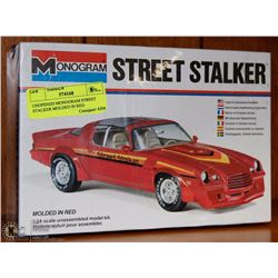 UNOPENED MONOGRAM STREET STALKER MOLDED IN RED