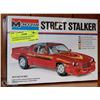 Image 1 : UNOPENED MONOGRAM STREET STALKER MOLDED IN RED