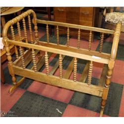 ANTIQUE ROCKING WOOD CRIB W/ ANTIQUE DOLL 23X38X29