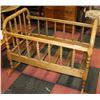 Image 1 : ANTIQUE ROCKING WOOD CRIB W/ ANTIQUE DOLL 23X38X29