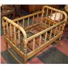 Image 2 : ANTIQUE ROCKING WOOD CRIB W/ ANTIQUE DOLL 23X38X29