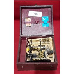 TOY SEWING MACHINE IN CASE