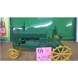 CAST IRON JOHN DEERE TOY TRACTOR WITH STEEL WHEELS
