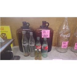 TWO BROWN JUGS (ONE CRACKED), 4 VARIOUS SIZES COCA-COLA BOTTLES AND COCA-COLA SALT AND PEPPER SHAKER