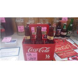 ONE PLASTIC COCA-COLA CARRIER WITH VINTAGE VARIOUS BEER BOTTLES