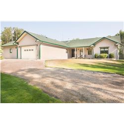 Gorgeous acreage with 2480 sq ft bungalow and 2 double attached heated garages with in floor heat. 2