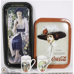2 COCA COLA TRAYS & 2 COCA COLA MUGS.