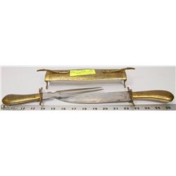 VINTAGE BRASS KNIFE AND FORK CARVING SET.