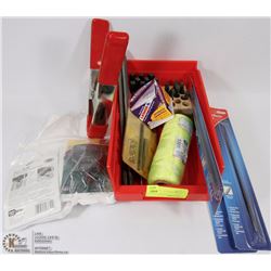 RED TRAY FILLED WITH FILES, CLAMP, AND MORE.