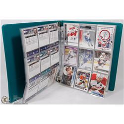 BINDER OF VARIOUS HOCKEY CARDS.