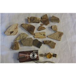 BAG OF FOSSILS AND WATCH AND DIGITAL CAMERA