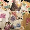 Image 2 : Bag Containing 1000's of Used US and Foreign Stamps some on Paper.
