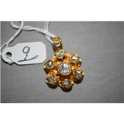 Ladies 18kt yellow gold pendant set with center 0.20ct rose cut polki diamond and six 0.05ct rose cu