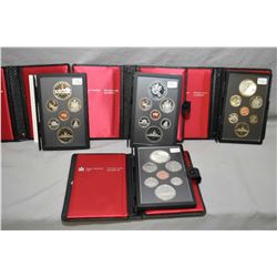 Four Royal Canadian Mint double dollar proof sets including a 1981 Canadian Railway set, 1983 Univer