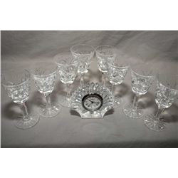 Eight signed Waterford sherry glasses plus a small shell motif Waterford clock
