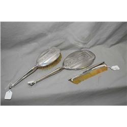 British sterling dresser set with hand mirror, brush and comb slide