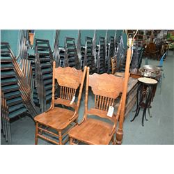 Pair of modern pressed back side chairs and a turned wooden pole lamp