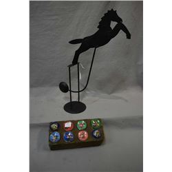 Eight horse motif glass saddle buttons and a metal works horse motif rocking pendulum 18" in height