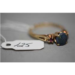 Ladies 10kt yellow gold, black cabochon opal and natural ruby ring. Retail replacement value $850.00