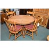 Image 1 : Modern round oak 42" table with insert leaf and center pedestal and four maple arrowback dining chai