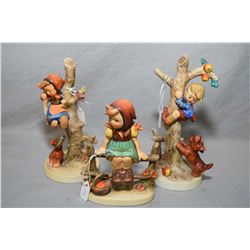 Three Goebel Hummel figures including Apple tree boy, plus girl in tree etc.