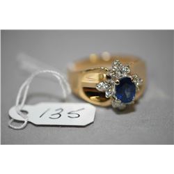 Ladies 14kt yellow gold, blue sapphire and diamond cluster ring, set with 0.36ct of brilliant round 