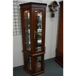 Semi-contemporary flat to the wall illuminated curio with glass shelves made by Strathroy