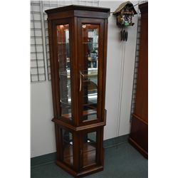 Semi-contemporary flat to the wall illuminated curio with glass shelves made by Strathroy