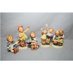 Five assorted Hummel and Goebel figurines including "Auf Wiedersehen", "Happy Passtime" etc.